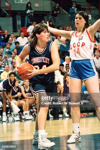 American basketball player Kerry Bascom, of the University of Connecticut, looks to pass after a rebound during a game against the Russian national...