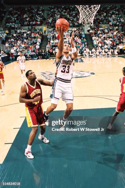 American basketball player Donny Marshall, of the University of Connecticut, drives during a game against Winthrop University, Hartford Connecticut,...