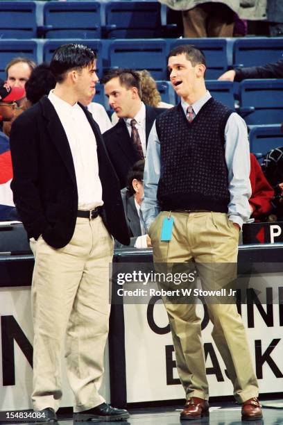 American basketball player Jeff Calhoun , of the University of Connecticut, listens to player Danny Hurley of Seton Hall as they both stand...