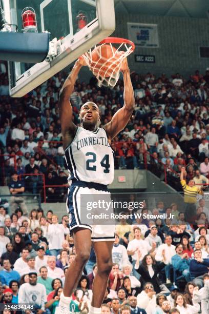American basketball player Scott Burrell, of the University of Connecticut, jams, Storrs, Connecticut, 1993.