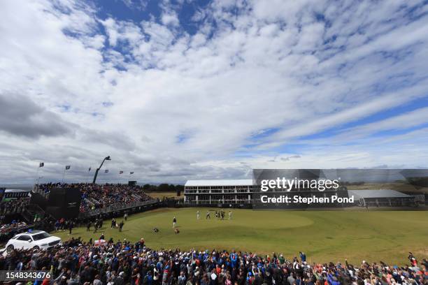 General view of the 18th green as Rory McIlroy of Northern Ireland acknowledges the crowd after putting in for a birdie to win the tournament during...