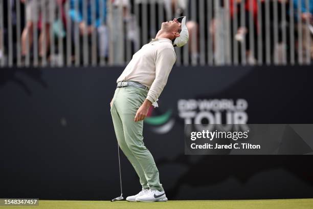 Rory McIlroy of Northern Ireland celebrates after putting in for a birdie on the 18th green to win the tournament during Day Four of the Genesis...