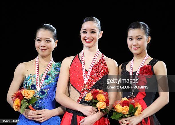 Gold medalist Kaetlyn Osmond of Canada is joined by silver medalist Akiko Suzuki of Japan and bronze medalist Kanako Murakami of Japan during the...