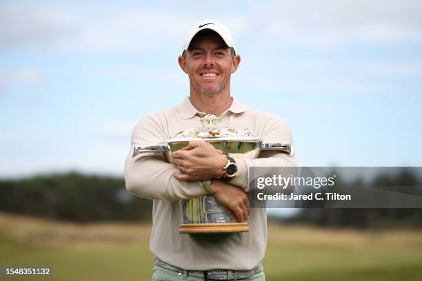 Rory McIlroy of Northern Ireland poses for a photo with the Genesis Scottish Open trophy on the 18th green after winning the tournament during Day...