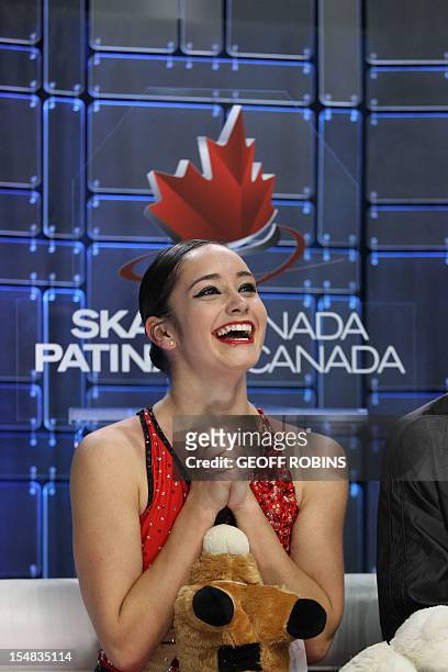 Kaetlyn Osmond of Canada reacts to her first place marks in the free program of the ladies competition at the 2012 Skate Canada International ISU...