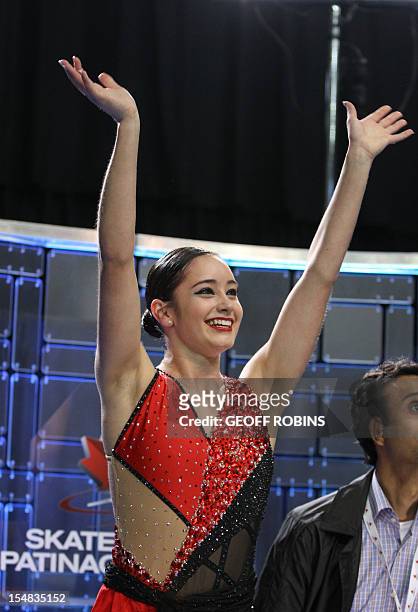 Kaetlyn Osmond of Canada reacts to her first place marks in the free program of the ladies competition at the 2012 Skate Canada International ISU...