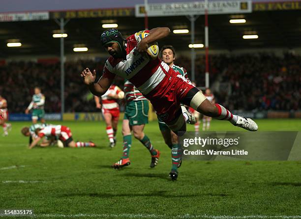 Akapusi Qera of Gloucester dives to score a try during the Aviva Premiership match between Gloucester and Leicester Tigers at Kingsholm Stadium on...