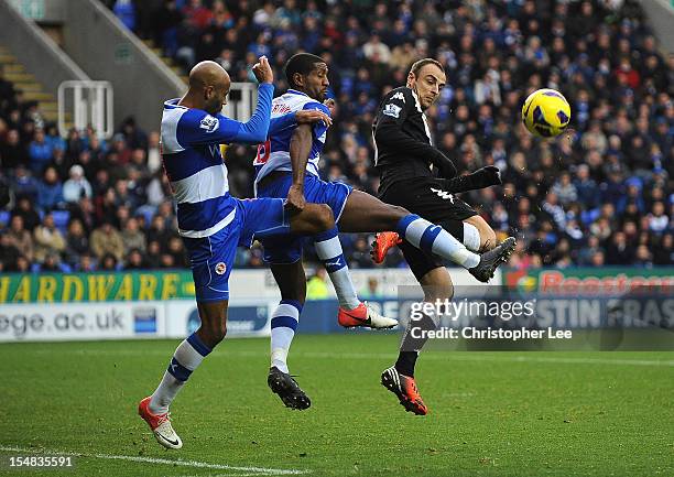 Jimmy Kebe and Mikele Leigertwood of Reading go for the ball with Dimitar Berbatov of Fulham during the Barclays Premier League match between Reading...