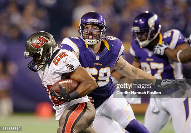 Doug Martin of the Tampa Bay Buccaneers carries the ball against Jared Allen of the Minnesota Vikings during the game on October 25, 2012 at Mall of...