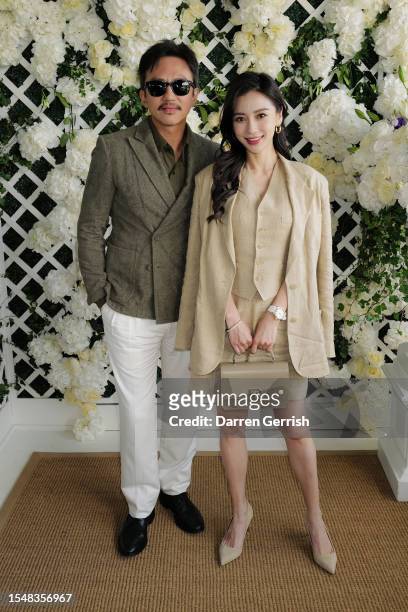 Deng Chao and Angelababy wearing Ralph Lauren, attend the Ralph Lauren Suite during The Championships, Wimbledon at All England Lawn Tennis and...