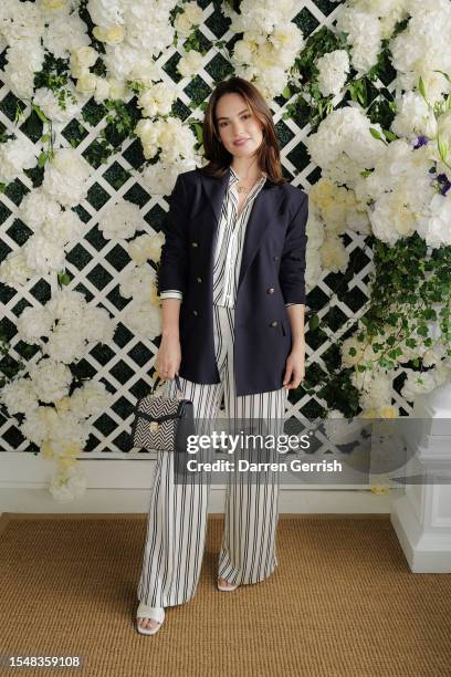 Lily James wearing Ralph Lauren, attends the Ralph Lauren Suite during The Championships, Wimbledon at All England Lawn Tennis and Croquet Club on...