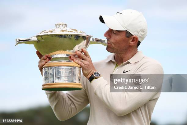 Rory McIlroy of Northern Ireland poses for a photo with the Genesis Scottish Open trophy on the 18th green after winning the tournament during Day...