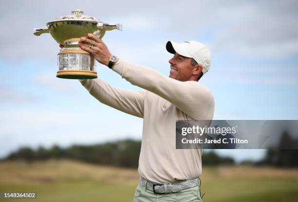 Rory McIlroy of Northern Ireland poses for a photo with the Genesis Scottish Open trophy on the 18th green after winning the tournament during Day...