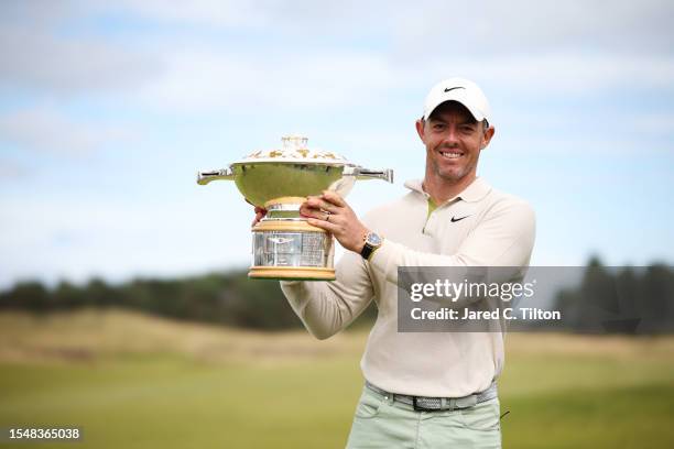 Rory McIlroy of Northern Ireland poses for a photo with the Genesis Scottish Open trophy on the 18th green after winning the tournament during Day...