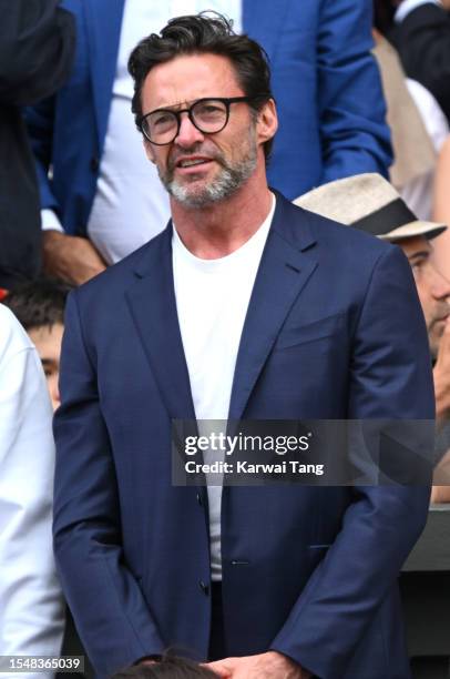 Hugh Jackman watches Carlos Alcaraz vs Novak Djokovic in the Wimbledon 2023 men's final on Centre Court during day fourteen of the Wimbledon Tennis...