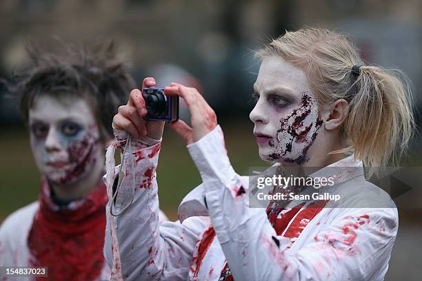 Zombie enthiusiasts gather before setting out on a "Zombie Walk" in the city center on October 27, 2012 in Berlin, Germany. Approximately 150...