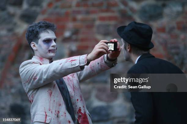 Zombie enthiusiasts gather before setting out on a "Zombie Walk" in the city center on October 27, 2012 in Berlin, Germany. Approximately 150...