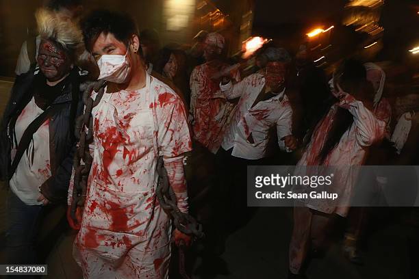 Zombie enthusiasts set out on a "Zombie Walk" in the city center on October 27, 2012 in Berlin, Germany. Approximately 150 zombies, who had organized...