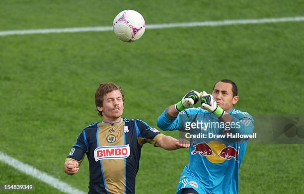 Goalkeeper Luis Robles of the New York Red Bulls gets set to punch the ball away from Antoine Hoppenot of the Philadelphia Union at PPL Park on...