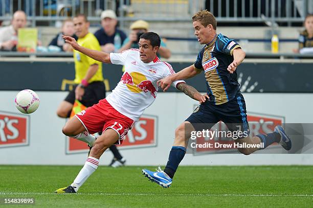 Chris Albright of the Philadelphia Union and Tim Cahill of the New York Red Bulls chase the ball at PPL Park on October 27, 2012 in Chester,...