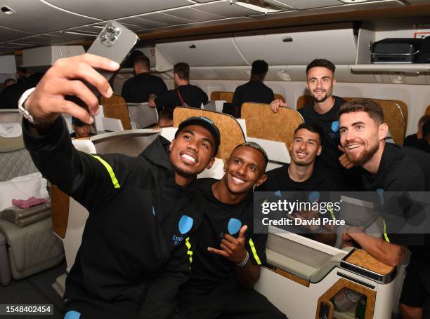 Gabriel Magalhaes, Marquinhos, Gabriel Martinelli, Jorginho and Fabio Vieira of Arsenal prepare to travel to the US at Stansted Airport on July 16,...