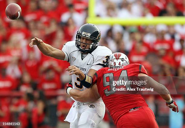 Spencer Keith of the Kent State Golden Flashes is tackled by Scott Vallone of the Rutgers Scarlet Knights at High Point Solutions Stadium on October...