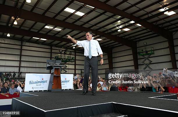 Republican presidential candidate, former Massachusetts Gov. Mitt Romney greets supporters during a campaign rally at Ranger Jet Center on October...