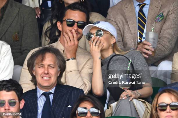 Jonathan Bailey and Ariana Grande watch Carlos Alcaraz vs Novak Djokovic in the Wimbledon 2023 men's final on Centre Court during day fourteen of the...