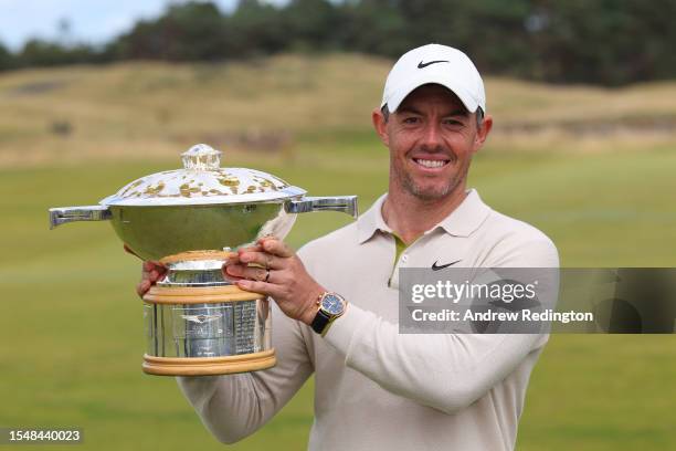 Rory McIlroy of Northern Ireland poses for a photo with the Genesis Scottish Open trophy on the 18th green after winning the tournament during Day...