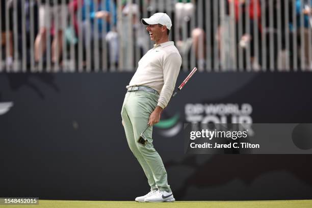 Rory McIlroy of Northern Ireland celebrates after putting in for a birdie on the 18th green to win the tournament during Day Four of the Genesis...