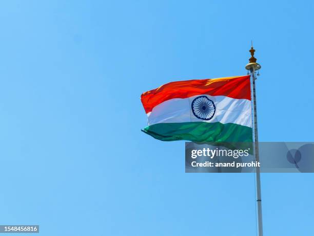 indian flag flying in wind - republic day india stock pictures, royalty-free photos & images