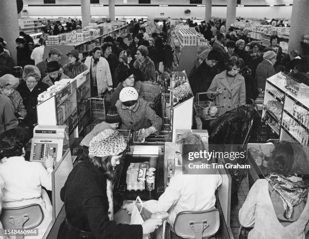 Shoppers queuing at the checkouts of the J Sainsbury's supermarket, in Sutton, in the London Borough of Sutton, London, England, 10th April 1970.