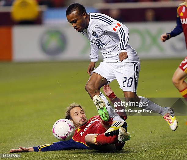 Ned Grabavoy of Real Salt Lake tries to take the ball from Dane Richards of Vancouver Whitecaps during the first half of an MLS soccer game October...
