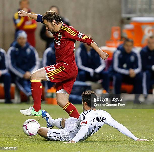 Ned Grabavoy of Real Salt Lake has the ball taken from him by John Thorrington of Vancouver Whitecaps during the first half of an MLS soccer game...