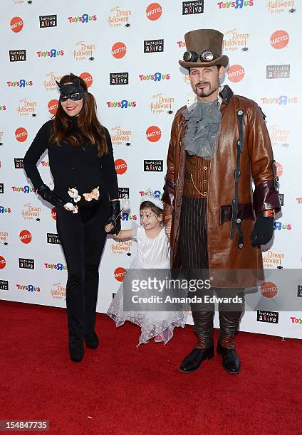 Actor Mark Deklin and his family arrive at the Keep A Child Alive 2012 Dream Halloween Party at Barker Hangar on October 27, 2012 in Santa Monica,...