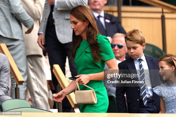 Catherine, Princess of Wales, Princess Charlotte of Wales, Prince George of Wales are seen returning to the Royal Box during the Men's Singles Final...