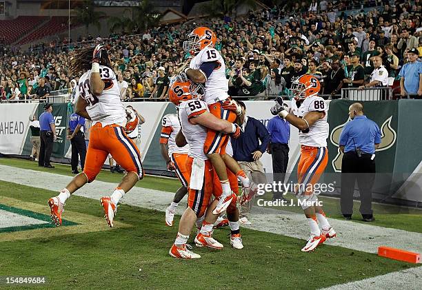 Receiver Alec Lemon of the Syracuse Orange celebrates his game winning touchdown against the South Florida Bulls during the game at Raymond James...