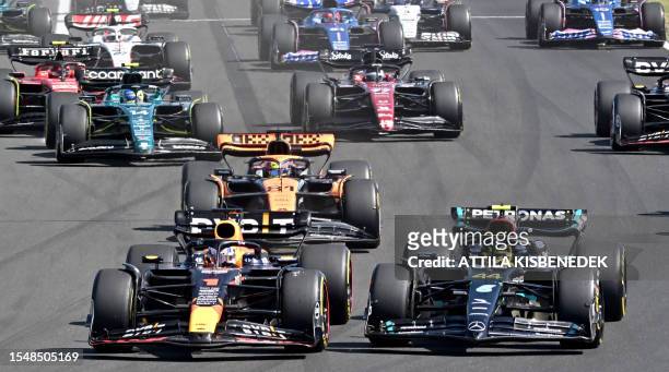 Red Bull Racing's Dutch driver Max Verstappen , Mercedes' British driver Lewis Hamilton and others race during the Formula One Hungarian Grand Prix...