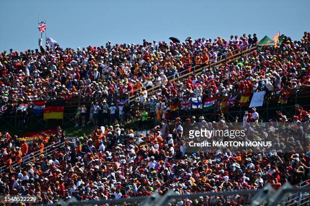 Fans follow the Formula One Hungarian Grand Prix at the Hungaroring race track in Mogyorod near Budapest on July 23, 2023.