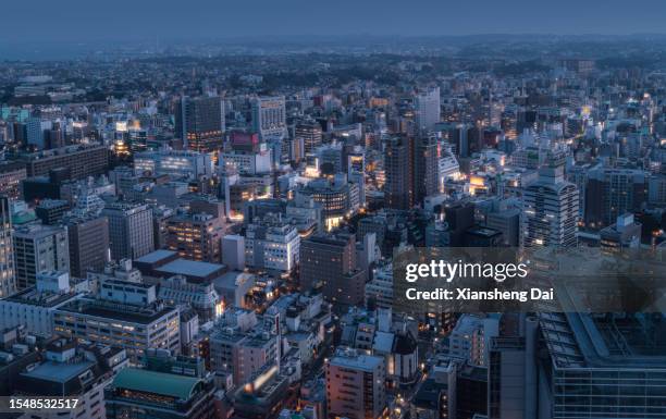 dusk descends over yokohama: an aerial perspective - yokohama stock pictures, royalty-free photos & images