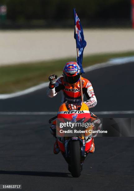 Casey Stoner of Australia riding the Repsol Honda Team Honda celebrates after winning the Australian MotoGP, which is round 17 of the MotoGP World...