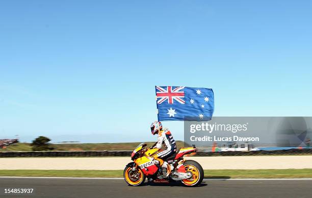 Casey Stoner of Australia riding the Repsol Honda Team Honda celebrates after winning the Australian MotoGP, which is round 17 of the MotoGP World...