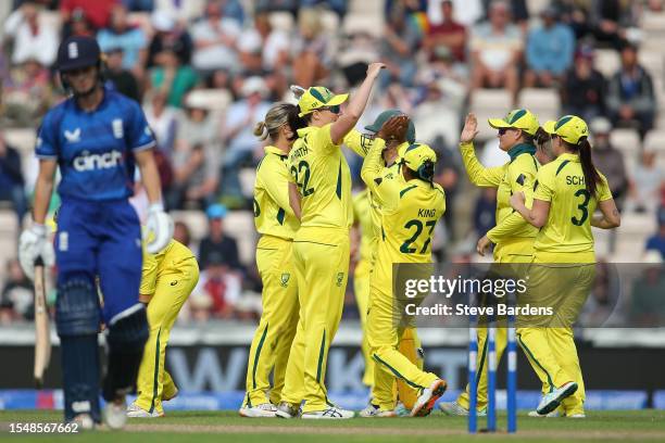 The Australia players celebrate with Megan Schutt after she takes the wicket of Amy Jones of England with a catch during the Women's Ashes 2nd We Got...