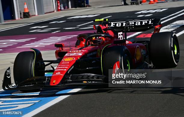 Ferrari's Spanish driver Carlos Sainz Jr leaves the pits during the Formula One Hungarian Grand Prix at the Hungaroring race track in Mogyorod near...