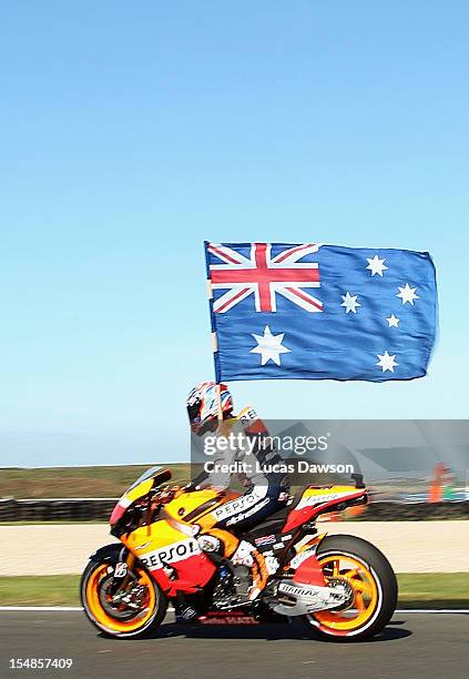 Casey Stoner of Australia riding the Repsol Honda Team Honda celebrates after winning the Australian MotoGP, which is round 17 of the MotoGP World...