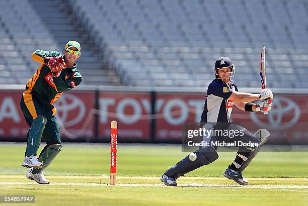 Aaron Finch of the Bushrangers bats and hits a boundary during the Ryobi One Day Cup match between Victorian Bushrangers and the Tasmanian Tigers at...