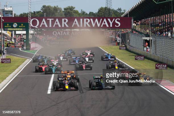 Max Verstappen of the Netherlands driving the Oracle Red Bull Racing RB19 leads Lewis Hamilton of Great Britain driving the Mercedes AMG Petronas F1...