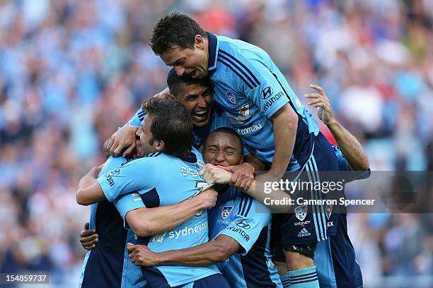 Brett Emerton of Sydney FC celebrates with team mates after scoring a goal during the round four A-League match between Sydney FC and the Perth Glory...