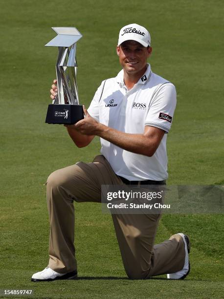 Nick Watney of USA poses with the CIMB Classic Trophy after the final round of the CIMB Classic at The MINES Resort & Golf Club on October 28, 2012...