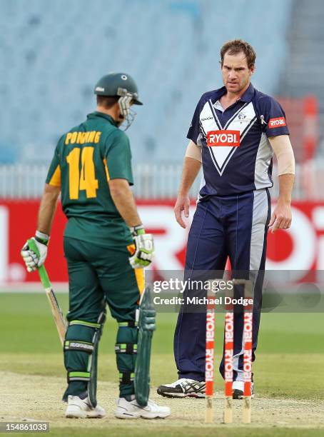 Bowler John Hastings of the Bushrangers looks towards Ricky Ponting of the Tigers during the Ryobi One Day Cup match between Victorian Bushrangers...